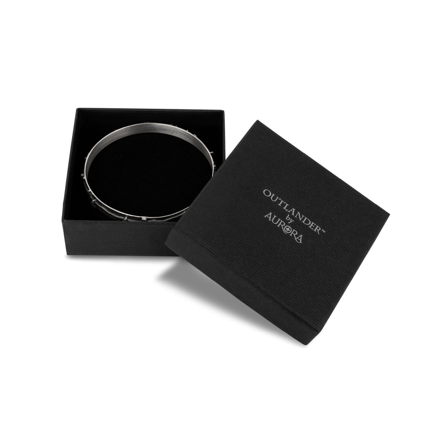 Boxed picture of Based on the Craigh na Dun stone circle featured in the Outlander TV series, This celtic jewelry bangle in sterling silver, by Aurora Jewellery Orkney, Scotland