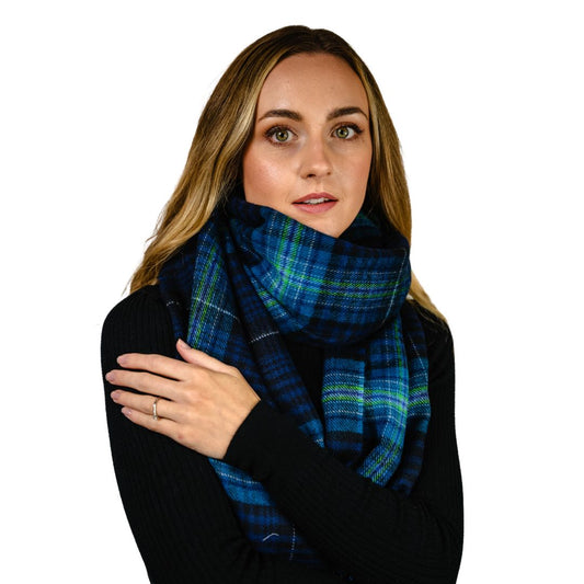 Model wearing the Northern Lights Scarf, exclusive tartan to Aurora Jewellery Orkney
