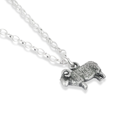 Silver sheep-shaped pendant on a chain against a white background