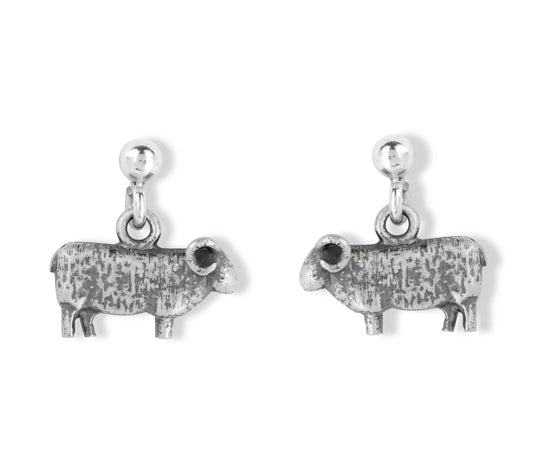 Pair of silver sheep-shaped earrings on a white background