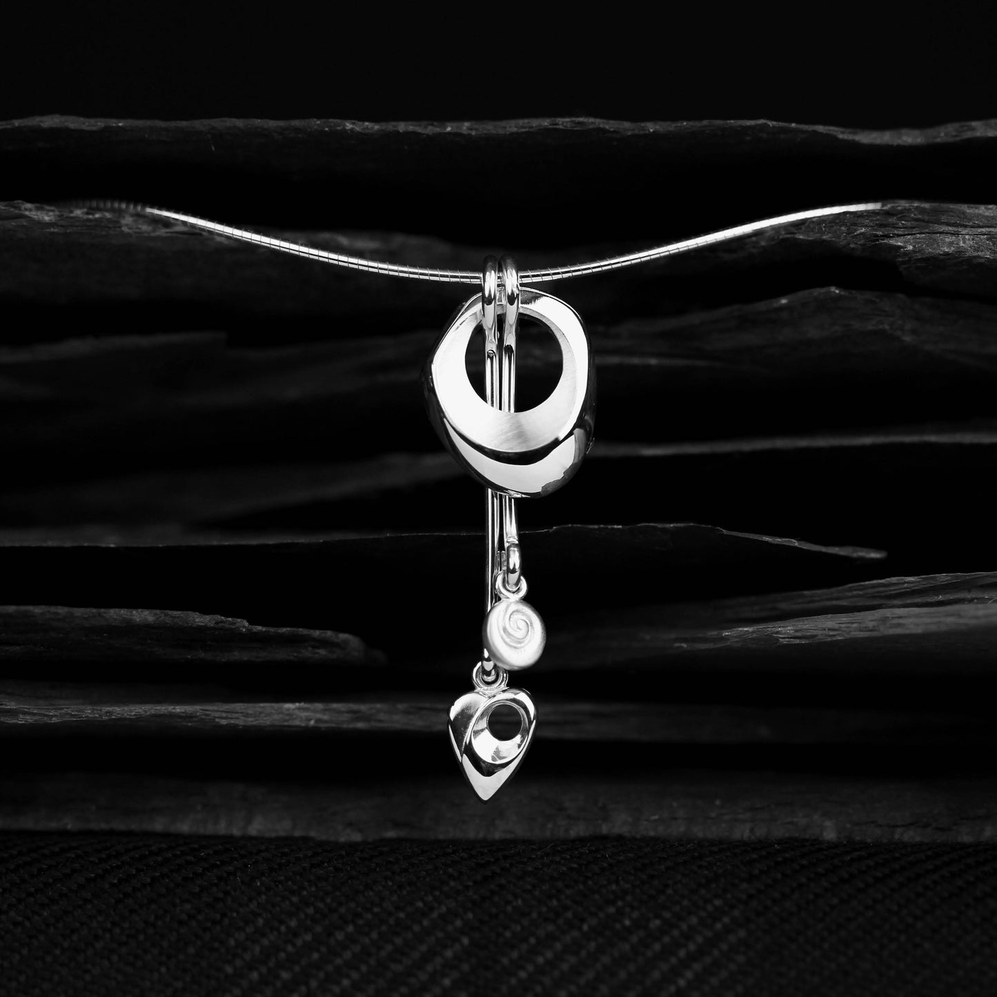 Detailed focus of the silver design, Crest Neckwire - Aurora Orkney Jewellery, Orkney, Scotland