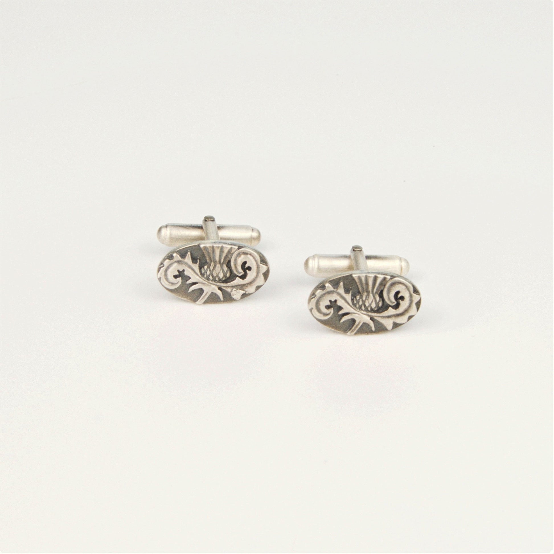 Outlander Rose Coin Collection Thistle Cufflinks on a white background with rose by Aurora Jewellery, Orkney, Scotland