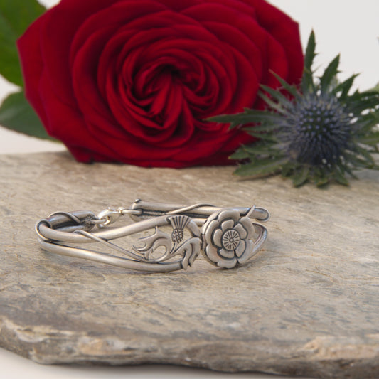 Outlander Eternally Yours Collection bracelet  on slate with rose and thistle background by Aurora Jewellery Orkney