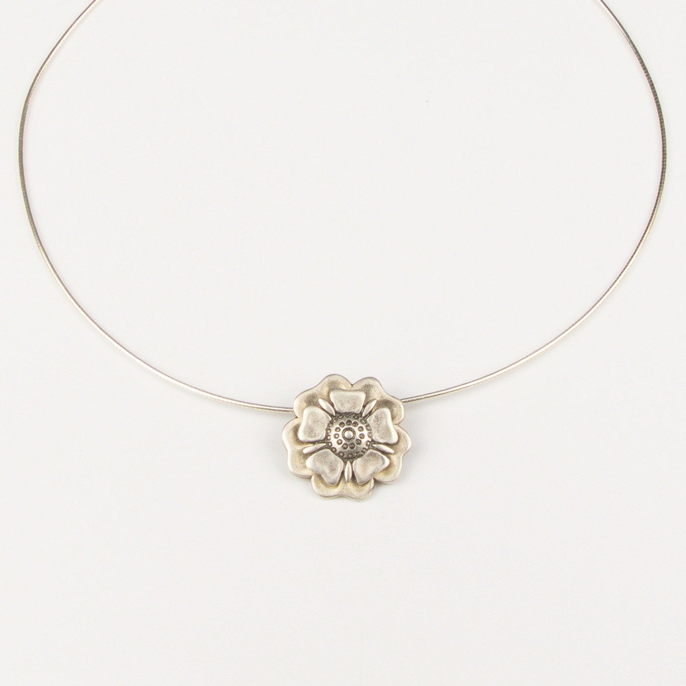 Outlander Jacobite Rose Coin Collection necklace with rose charm on a white background with rose by Aurora Jewellery, Orkney, Scotland