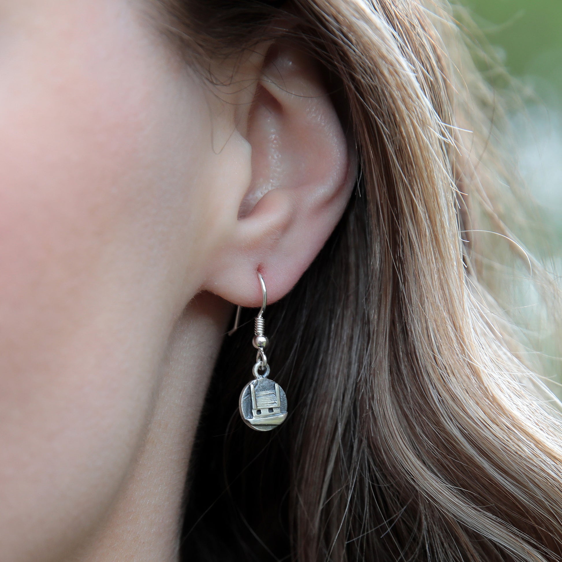 Model wearing Sterling silver Croft Drop Earrings by Aurora Orkney Jewellery, Orkney, Scotland